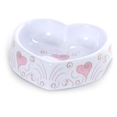 Petmate Presents Designer Bowls Hearts & Swirls-Pink/White Small. Petmate's Designer Bowls are Designed to Meet the Needs of the Fashion Forward, Trend Oriented Pet Owner. The Line Includes a Variety of Styles, Shapes, and Sizes for Cats and Dogs. These Bowls are Dishwasher Safe and will not Fade. They Resist Scratches and Nicks that can Trap Bacteria. Some Models Feature Finger Cut-Outs on Both Sides [26371]